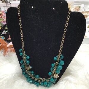 Gold chain with green beads